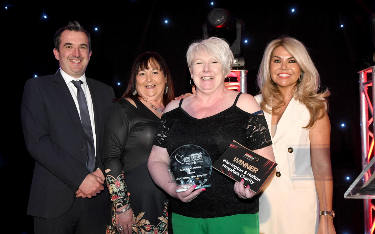 Charity team being presented with the charity of the year award.