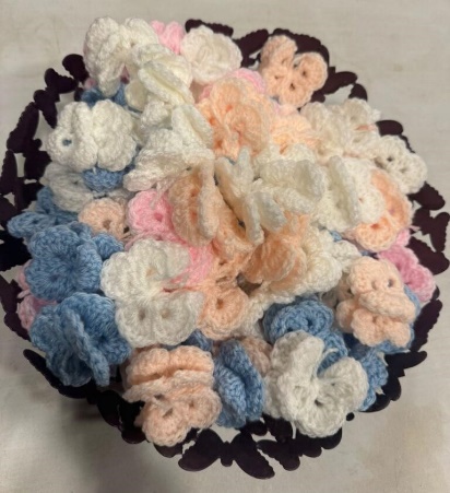 Knitted butterflies in a butterfly basket.