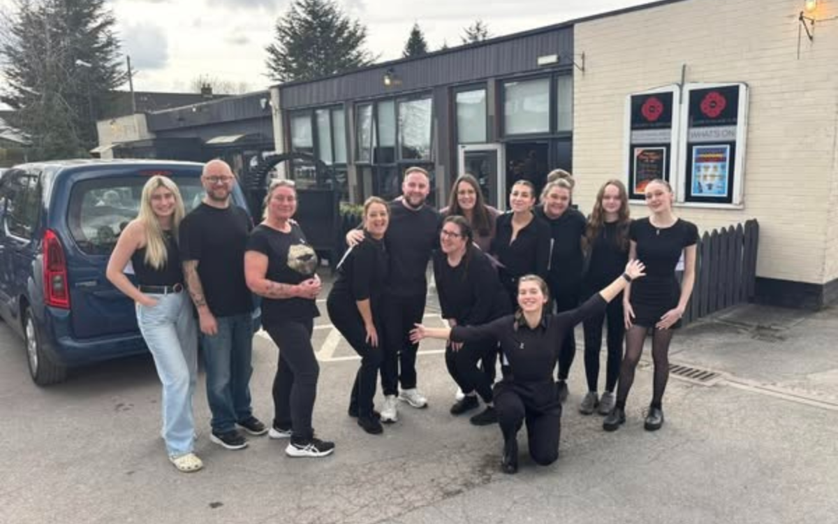 Culcheth Village Club team posing outside of the club.
