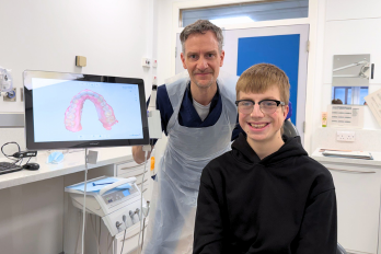 Patient Harry Underhill with consultant Ian Edwards and oral scanner.