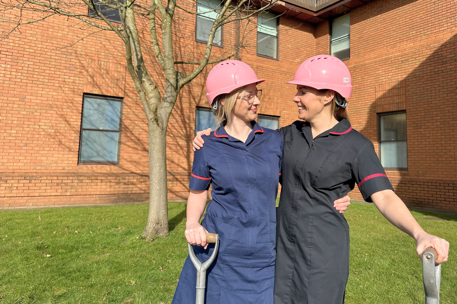 Neonatal staff in pink hard hats