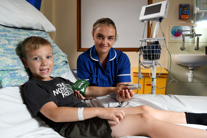 Young patient with nurse on the children's ward at Warrington Hospital
